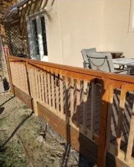 Stained wood deck railing built by Sylvatus Construction